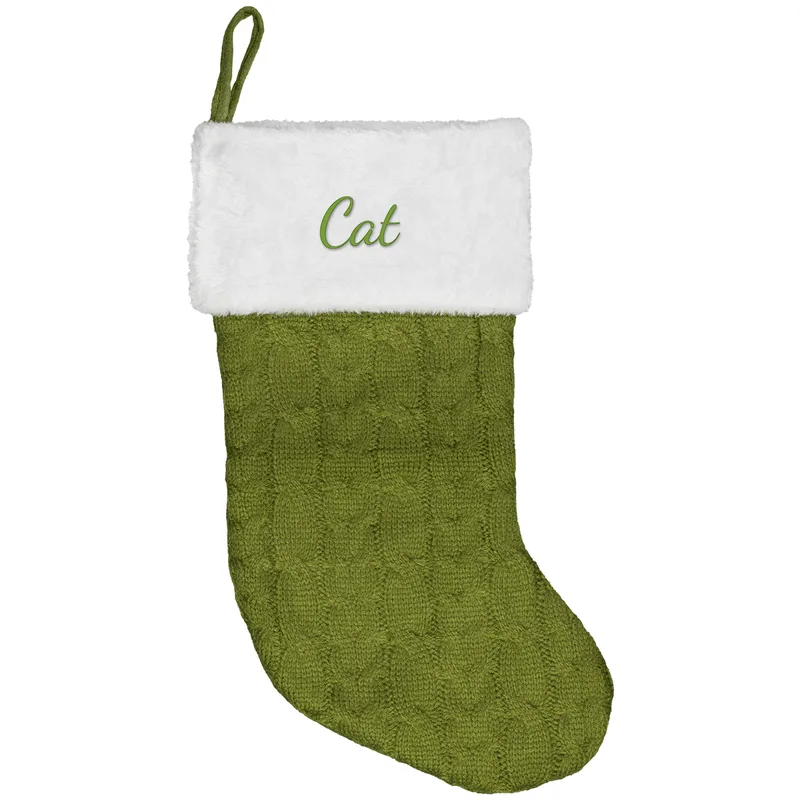 Cat embroidered on a green Christmas stocking