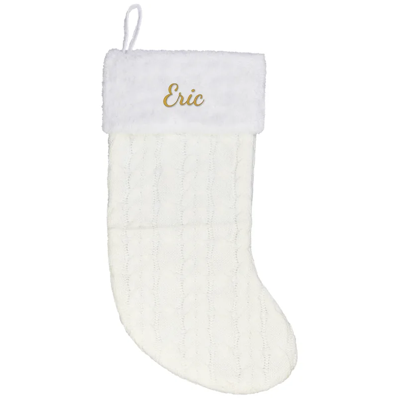 Eric embroidered on a cream Christmas stocking