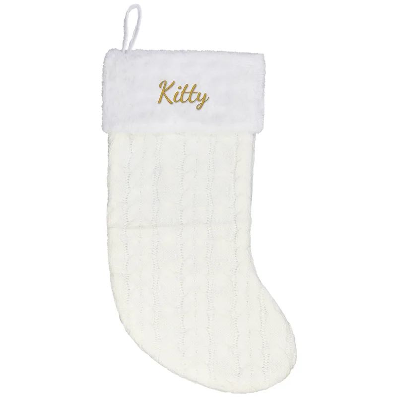 Kitty embroidered on a cream Christmas stocking