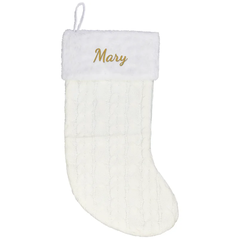 Mary embroidered on a cream Christmas stocking